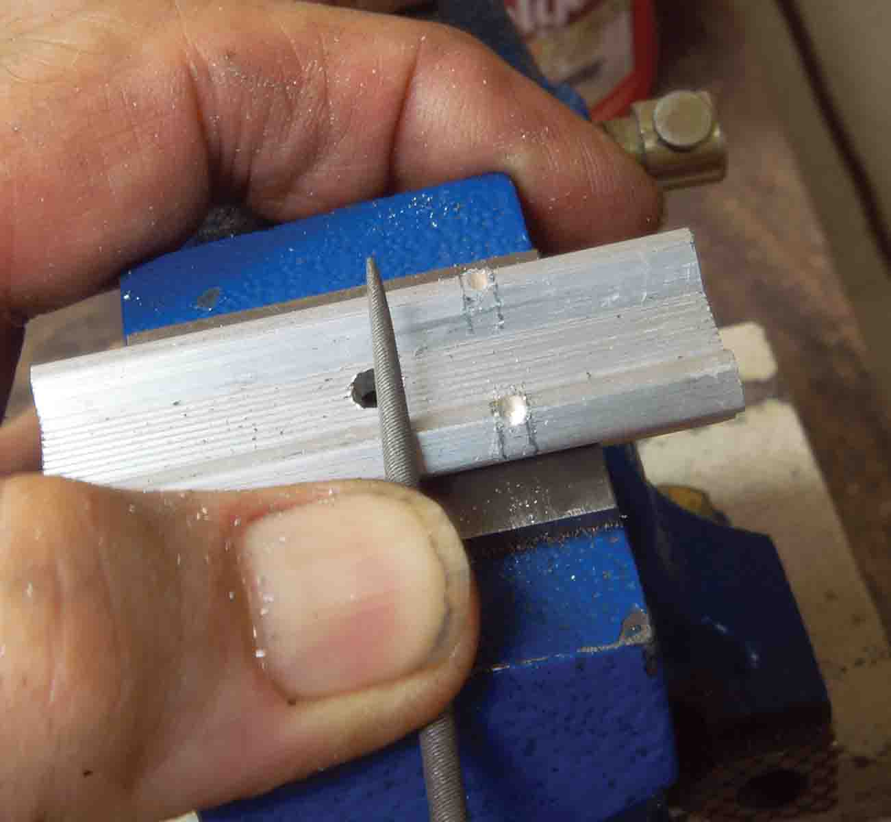 The cross-slot for the red dot locking bolt is marked on the base and cut with a round needle file.